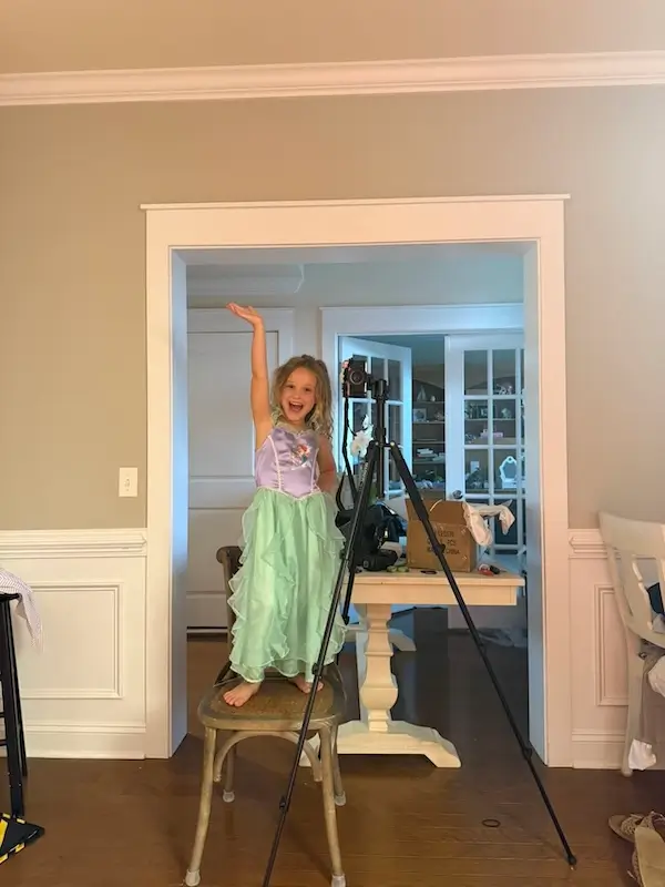 chandler and hannah nigh's daughter taking a photo